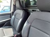 two seats in the back of a truck that are empty