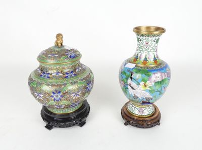 two vases sitting next to each other on a table