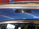 a close up of a car with a sticker on it