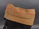 an image of a brown hat with a red line on it