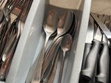 many spoons, forks, and spoons in a drawer