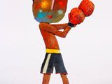 statue of a boy with boxing gloves on a white background