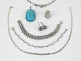 a lot of jewelry that is laying out on the table