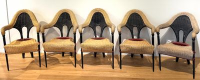 four chairs are lined up in a row on a wooden floor