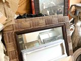 a pile of assorted items on a shelf in a room