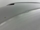 a close up of a car ' s hood with a lot of scratches on it