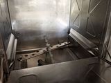 a stainless steel kitchen with a sink and a stove