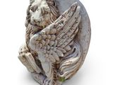 a statue of a lion with wings on it ' s head