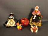 several figurines of different sizes and colors are lined up on a table