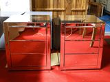pair of mirrored nightstands with drawers and drawers on red carpet