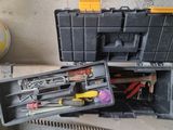 a tool box with tools in it sitting on the floor