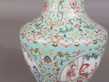 an image of a vase with flowers and birds painted on it