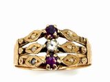 an image of a close up of a gold ring with purple stones