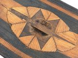 an old wooden boat with a decorative design on it