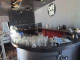 a bar with a lot of wine glasses on it