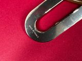 a pair of scissors that are on a red surface