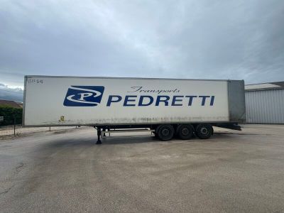 the truck is parked in the parking lot next to the building