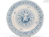 an image of a blue and white plate with a lion on it
