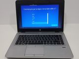 a laptop that is sitting on a table with a blue screen