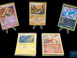 Six cartes Pokémon différentes sont représentées sur un fond noir.