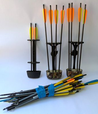 many arrows in a vase and a bunch of other arrows
