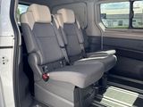 two seats in the back of a van with the door open