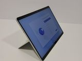 a laptop that is sitting on a white table