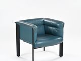 turquoise leather chair with black metal legs and arm rests against a white backdrop