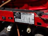 a close up of a red engine with a label on it