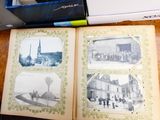 a book open on a table with pictures on it