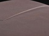 close up of a piece of leather with a thin line on it