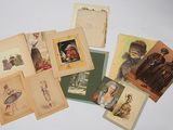 a lot of old postcards on the table