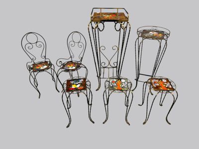 four chairs and a table with a tray on top of them
