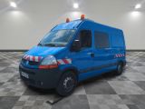 a picture of a blue van parked in a large room