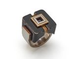 a close up of a ring on a white surface