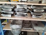 many trays of food on the shelves in the kitchen