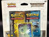 a box of pokemon cards and a card holder
