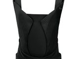 the back of a woman ' s black dress on a white background