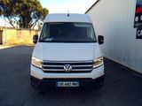 the white van is parked in front of a building