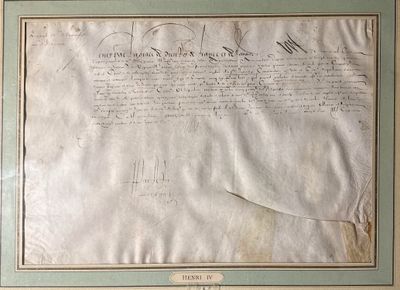an old document with writing on it sitting on a table