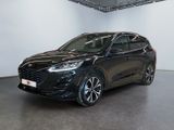 a black ford kuga parked in a large room
