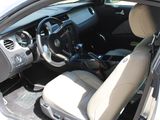 the interior of a car with a steering wheel and a dashboard