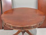 a table that has a wooden top and a wooden base