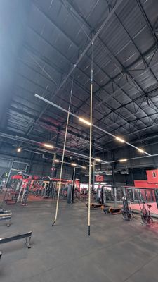 a gym with a lot of equipment in the room
