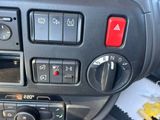 a close up of a car ' s dashboard with various controls