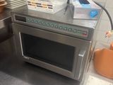 a microwave that is sitting on a counter in a kitchen