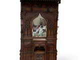 a wooden cabinet with a mirror on top of it