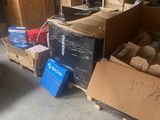 many boxes and boxes on the floor in the garage