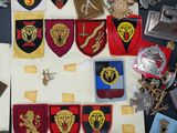 a lot of badges and other items on a table