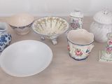 a table with a lot of dishes and bowls on it